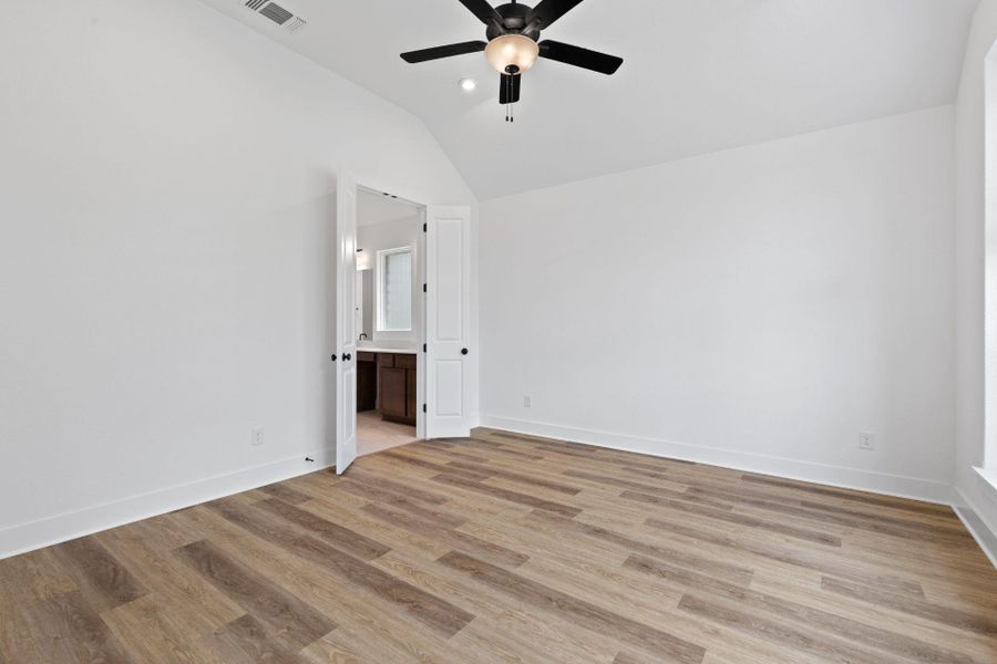 Primary Bedroom with elevated ceiling Primary Bedroom with elevated ceiling