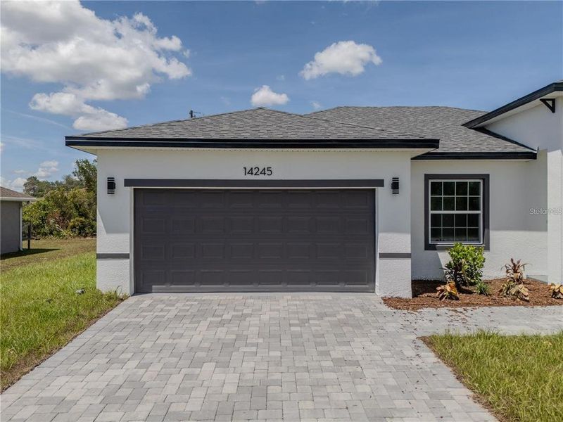 Front exterior of a new home in , Ocala, FL, highlighting curb appeal (Image 2). Front exterior of a new home in , Ocala, FL, highlighting curb appeal (Image 2).