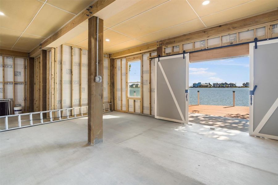 Barn doors lead to the waterfront deck Barn doors lead to the waterfront deck