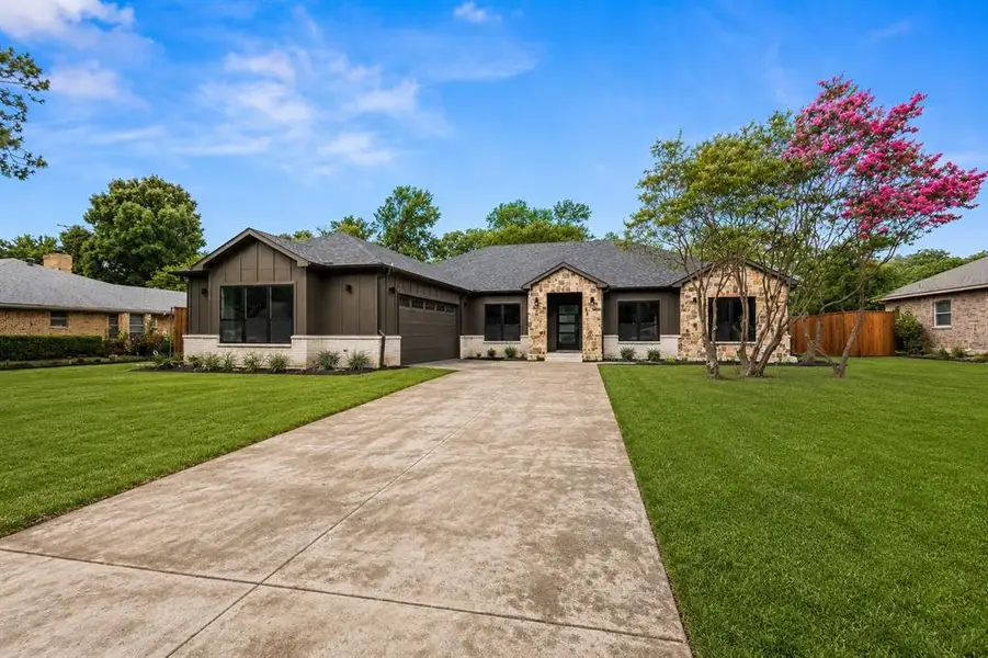 Front exterior of a new home in , Sachse, TX, highlighting curb appeal (Image 1). Front exterior of a new home in , Sachse, TX, highlighting curb appeal (Image 1).