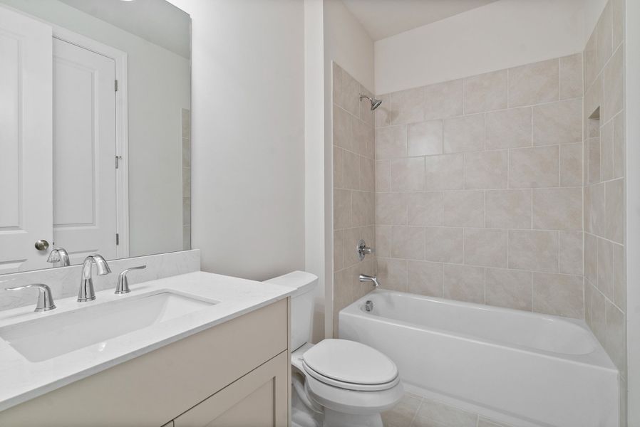 Representative furnished interior of a home built from the The McIntosh by The Providence Group in Promenade at Sawnee Village, Cumming (Image 10).