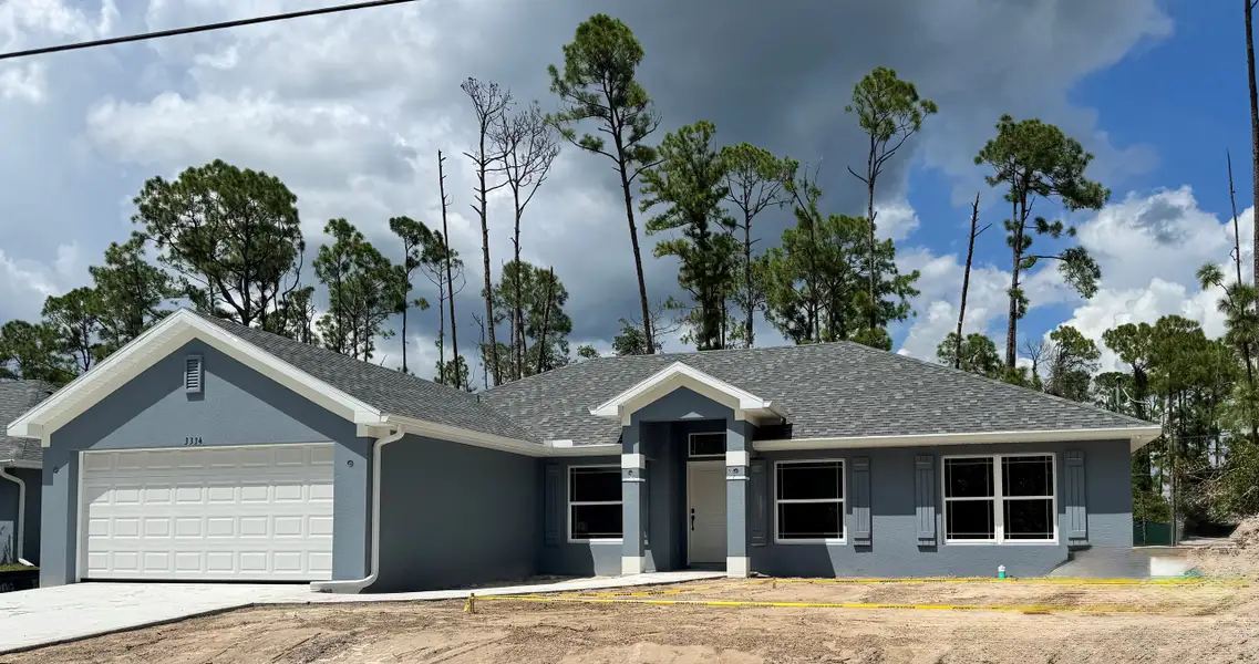 Front exterior of a new home in North Port, North Port, FL, highlighting curb appeal (Image 1). Front exterior of a new home in North Port, North Port, FL, highlighting curb appeal (Image 1).