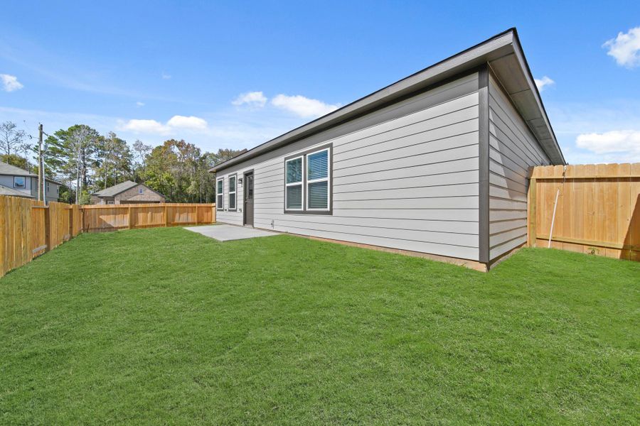 Exterior details and patio area of a home in Lexington Heights, Willis (Image 3). Exterior details and patio area of a home in Lexington Heights, Willis (Image 3).