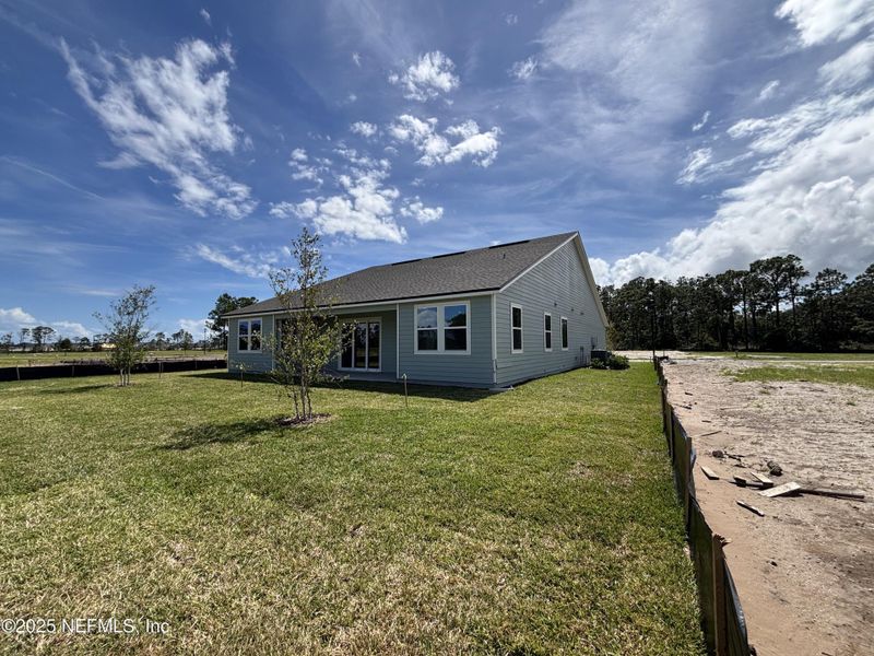 Front exterior of a new home in The Cypress Series at Reserve East, Flagler Beach, FL, highlighting curb appeal (Image 19).