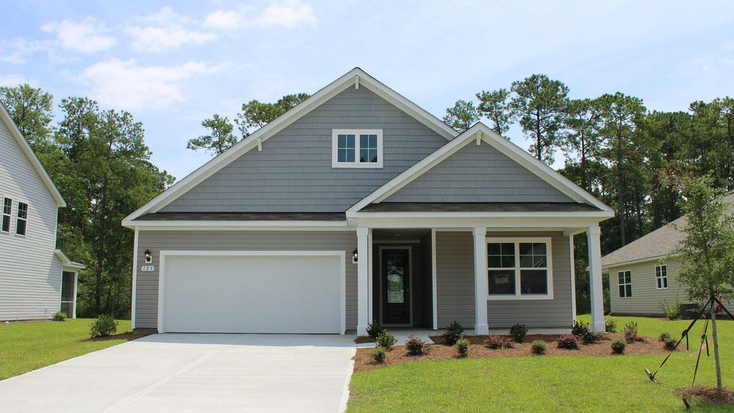 Front exterior of a new home in The Preserve at Shaftesbury Glen, Conway, SC, highlighting curb appeal (Image 1).