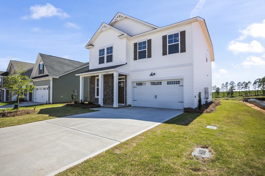Front exterior of a new home in Providence Station at Trolley Run, Aiken, SC, highlighting curb appeal (Image 2).