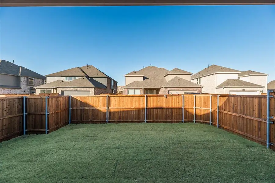 Exterior details and patio area of a home in Villages of Creekwood, Frisco (Image 4).