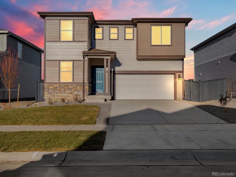 Front exterior of a new home in Westgate, Greeley, CO, highlighting curb appeal (Image 1).