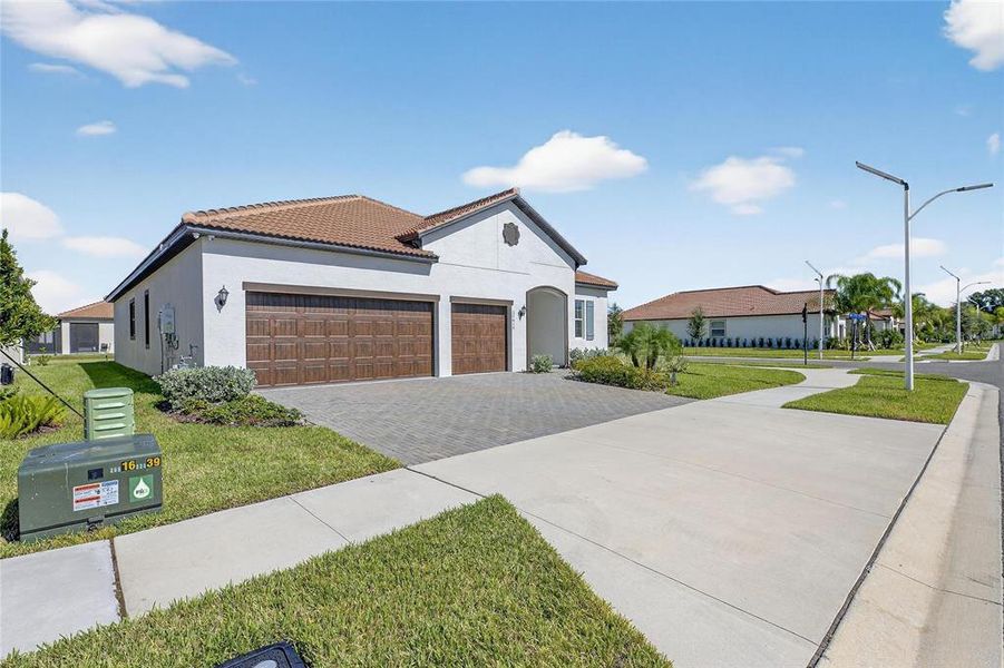 Front exterior of a new home in , Wimauma, FL, highlighting curb appeal (Image 27).
