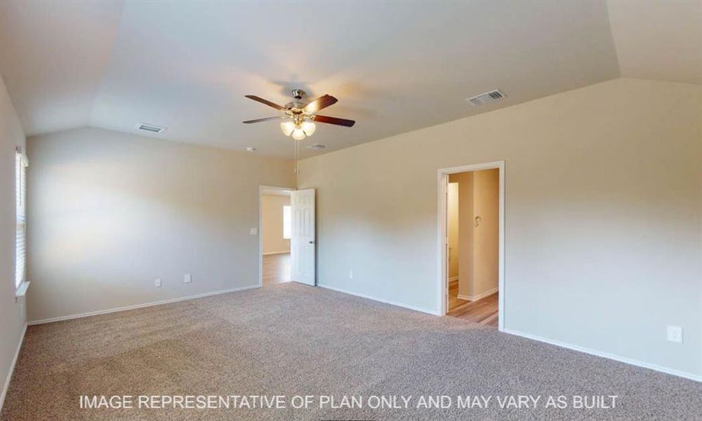 Spacious room featuring vaulted ceilings, neutral-toned carpeting, a ceiling fan with integrated lighting, and multiple windows Spacious room featuring vaulted ceilings, neutral-toned carpeting, a ceiling fan with integrated lighting, and multiple windows