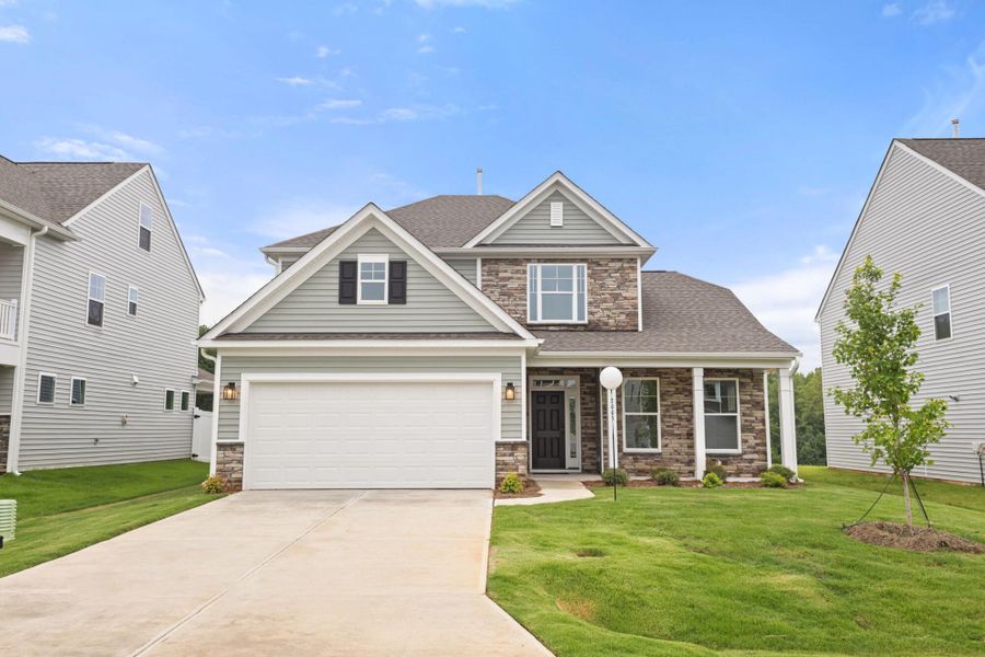 Front exterior of a new home in Monterra, Kernersville, NC, highlighting curb appeal (Image 1). Front exterior of a new home in Monterra, Kernersville, NC, highlighting curb appeal (Image 1).