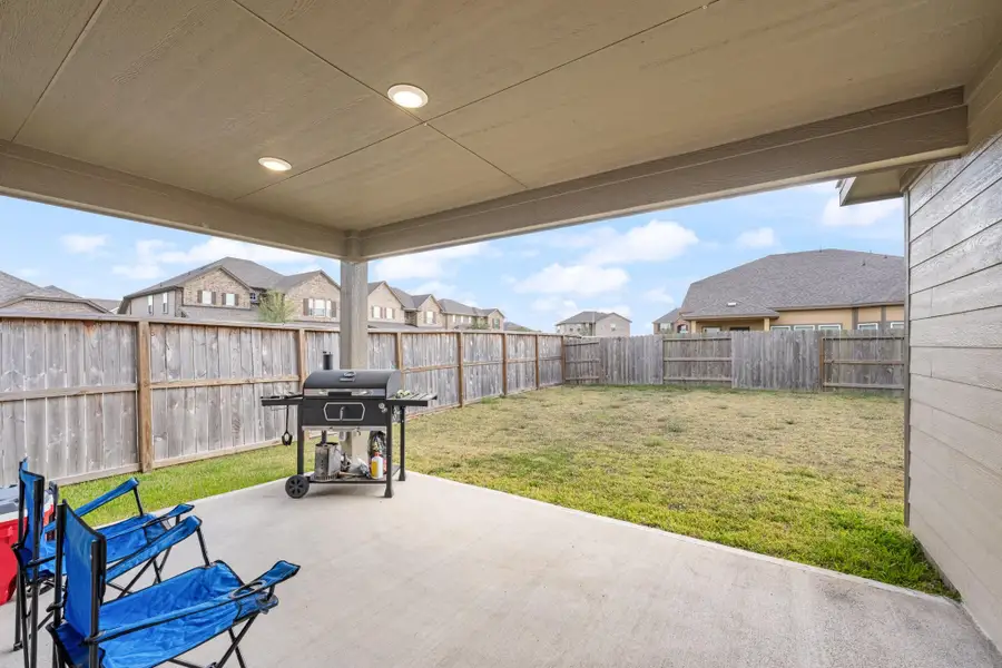 Exterior details and patio area of a home in Sierra Vista, Iowa Colony (Image 24).