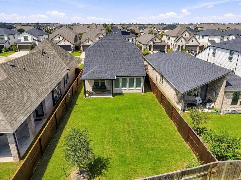 This aerial perspective highlights the expansive backyard, offering generous space for outdoor living, entertaining, child and pet play or creating a private pool and backyard retreat. This aerial perspective highlights the expansive backyard, offering generous space for outdoor living, entertaining, child and pet play or creating a private pool and backyard retreat.