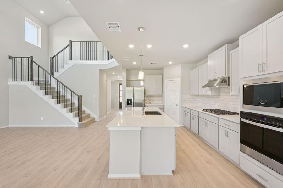 Furnished interior view inside a new home in Riviera Pines - Classic Series, Huffman (Image 6).