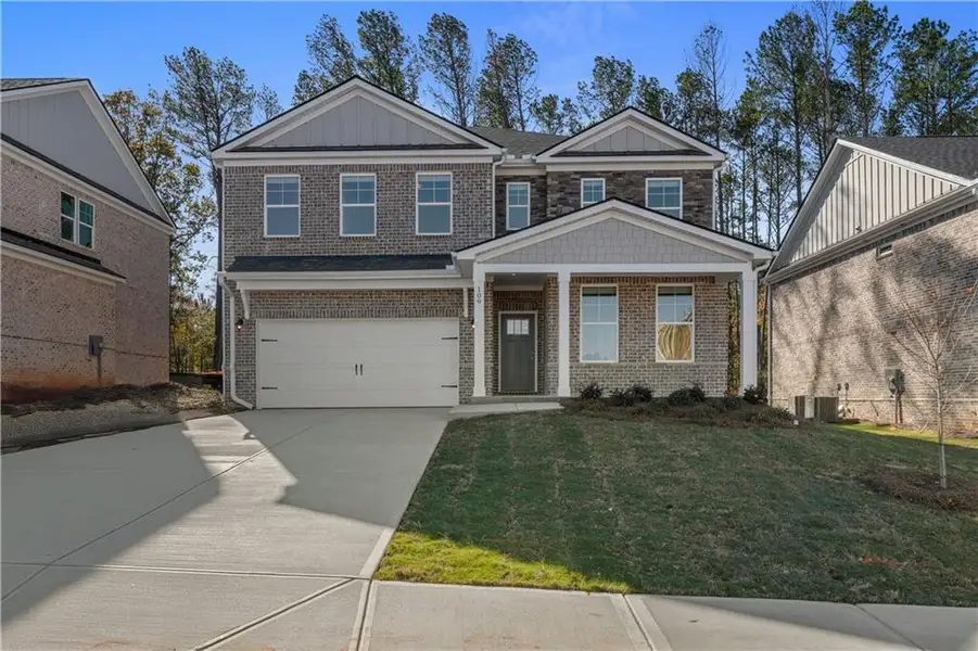 Front exterior of a new home in Bowers Farm, McDonough, GA, highlighting curb appeal (Image 2). Front exterior of a new home in Bowers Farm, McDonough, GA, highlighting curb appeal (Image 2).