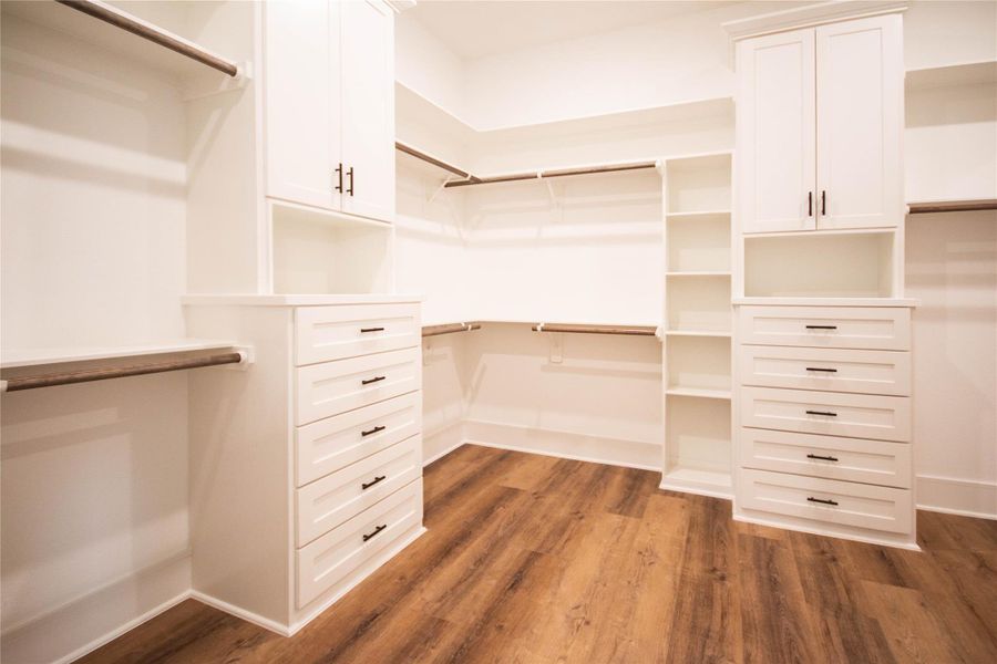 Discover the stunning Mayberry closets, designed with built-in features that optimize both space and style. The closet measures a generous 11 x 11 feet, offering plenty of room for all your storage needs. Additionally, the Primary closet includes a door that leads directly to the laundry room. Discover the stunning Mayberry closets, designed with built-in features that optimize both space and style. The closet measures a generous 11 x 11 feet, offering plenty of room for all your storage needs. Additionally, the Primary closet includes a door that leads directly to the laundry room.