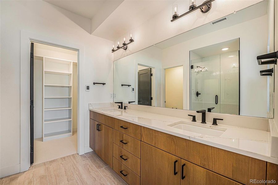 Second level primary bathroom with walk-in closet