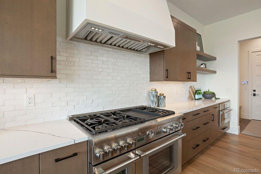 The modern kitchen includes Thermador appliances 2 dishwashers plus a Zephyr beverage cooler.