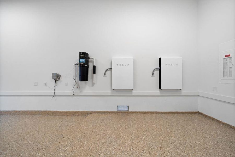 Home features owned solar PV system with two Tesla Powerwall batteries providing automatic backup power