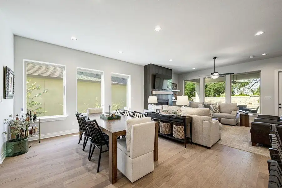 Dining room featuring recessed lighting, light wood-type flooring, and plenty of natural light Dining room featuring recessed lighting, light wood-type flooring, and plenty of natural light