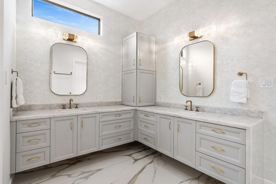 Double vanity sinks and plenty of storage. Double vanity sinks and plenty of storage.