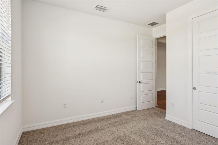 Spacious, unfurnished interior of a new home in Crescent Lakes - Signature Series, Punta Gorda (Image 16).