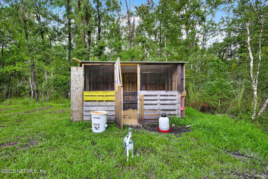 Front exterior of a new home in Flagler Estates, Hastings, FL, highlighting curb appeal (Image 21).