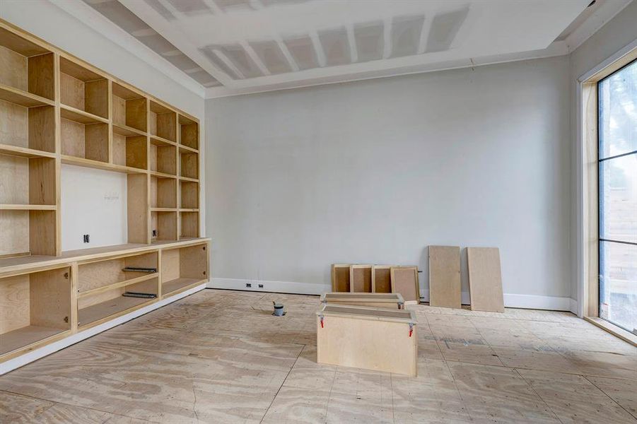 Study with built-ins off the foyer with windows overlooking front yard. Stage of construction as of April 3, 2025. Study with built-ins off the foyer with windows overlooking front yard. Stage of construction as of April 3, 2025.