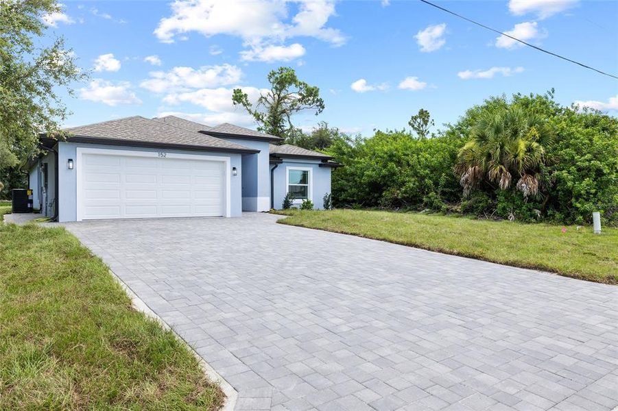 Front exterior of a new home in , Rotonda West, FL, highlighting curb appeal (Image 19).