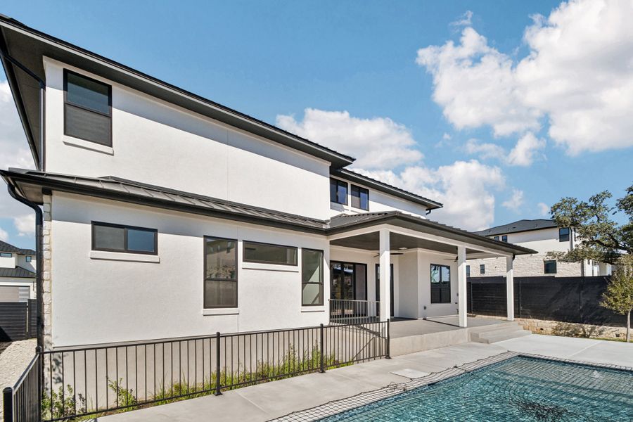 Exterior details and patio area of a home in Milky Way at River Place, Austin (Image 15).