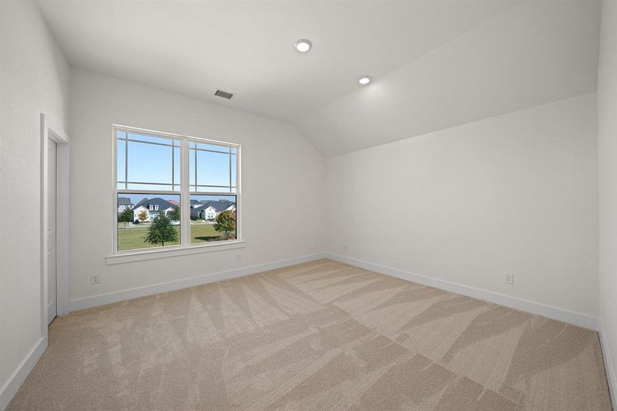 Bonus room with light carpet, lofted ceiling, and recessed lighting Bonus room with light carpet, lofted ceiling, and recessed lighting