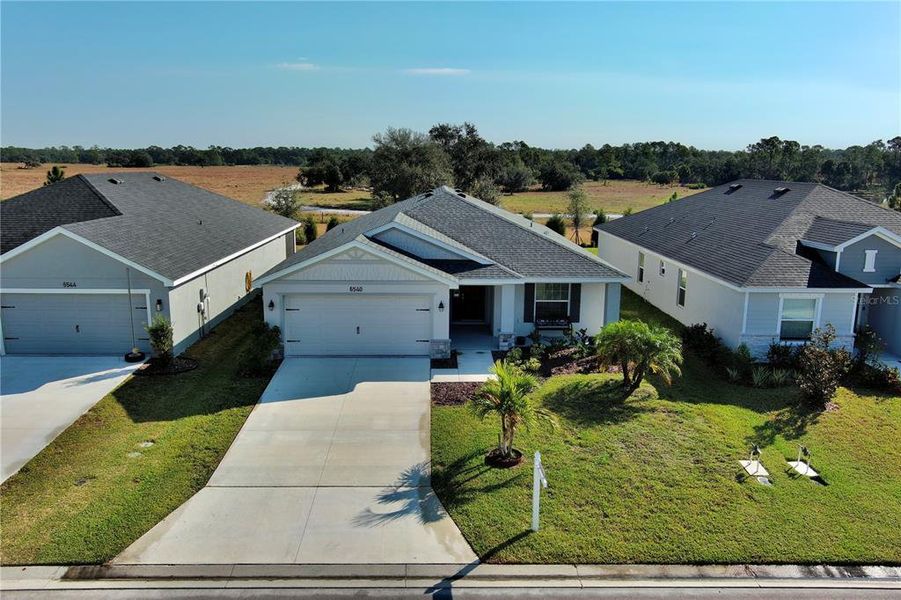 Front exterior of a new home in , Parrish, FL, highlighting curb appeal (Image 19).