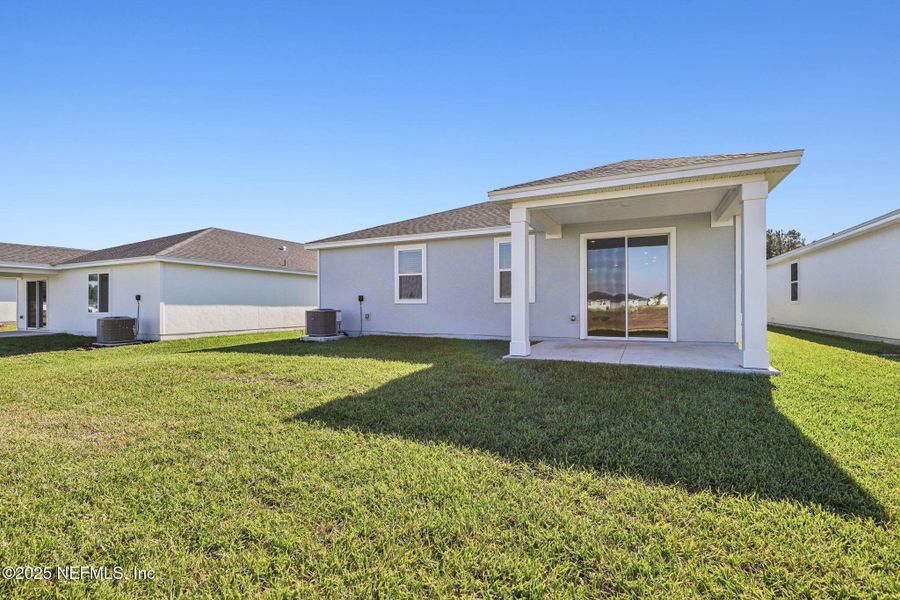 Exterior details and patio area of a home in Lakes at Bella Lago - Signature Series, Green Cove Springs (Image 3). Exterior details and patio area of a home in Lakes at Bella Lago - Signature Series, Green Cove Springs (Image 3).