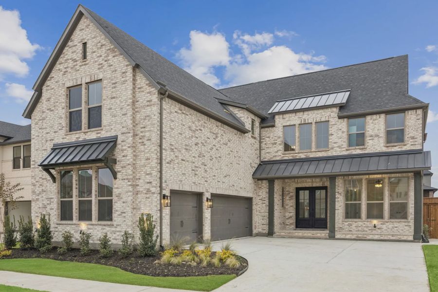 Front exterior of a new home in The Grove Frisco, Frisco, TX, highlighting curb appeal (Image 1). Front exterior of a new home in The Grove Frisco, Frisco, TX, highlighting curb appeal (Image 1).