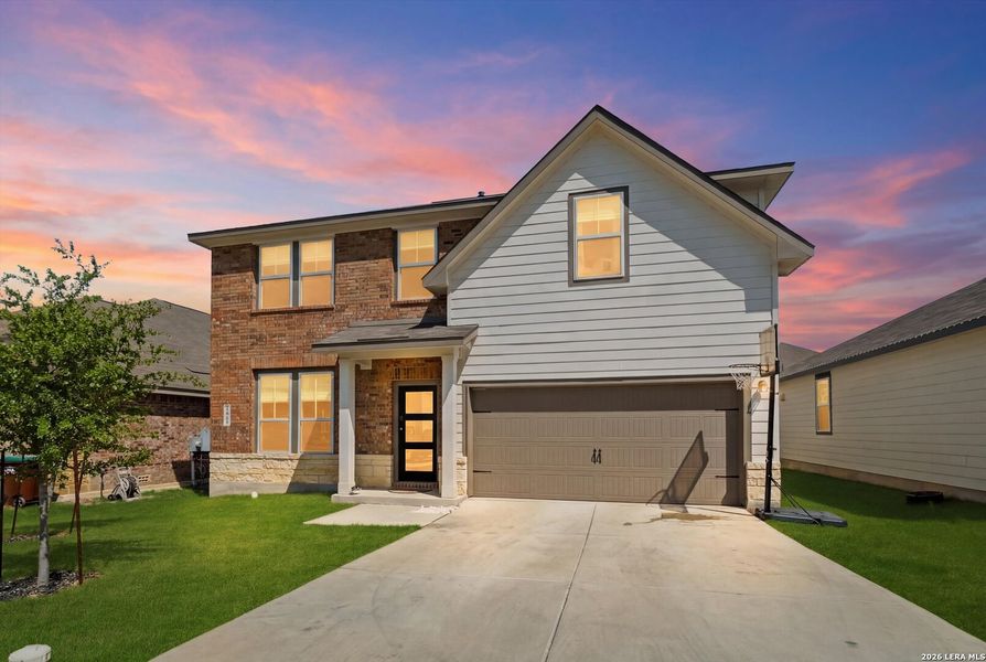 Front exterior of a new home in Horizon Pointe, Converse, TX, highlighting curb appeal (Image 21).