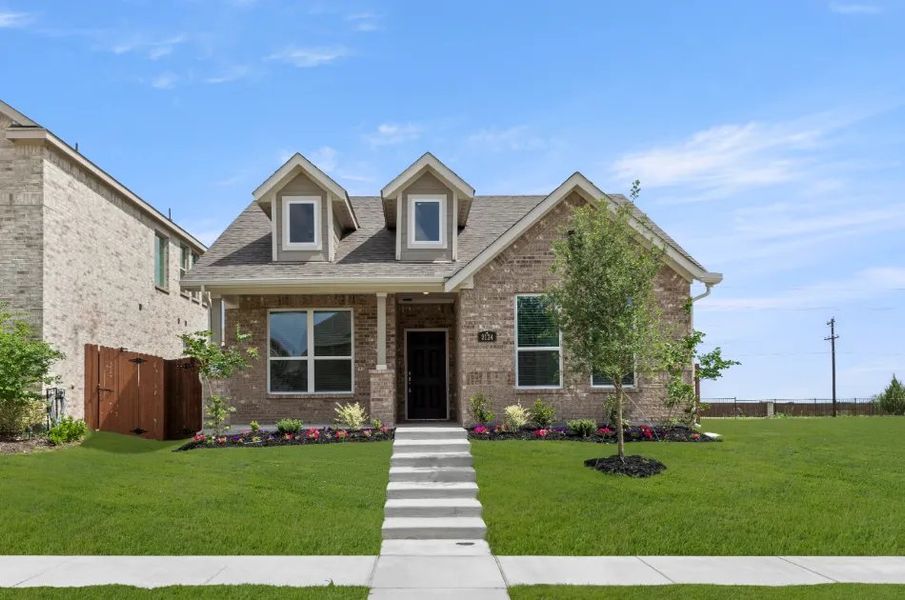 Front exterior of a new home in Heartland, Heartland, TX, highlighting curb appeal (Image 1). Front exterior of a new home in Heartland, Heartland, TX, highlighting curb appeal (Image 1).