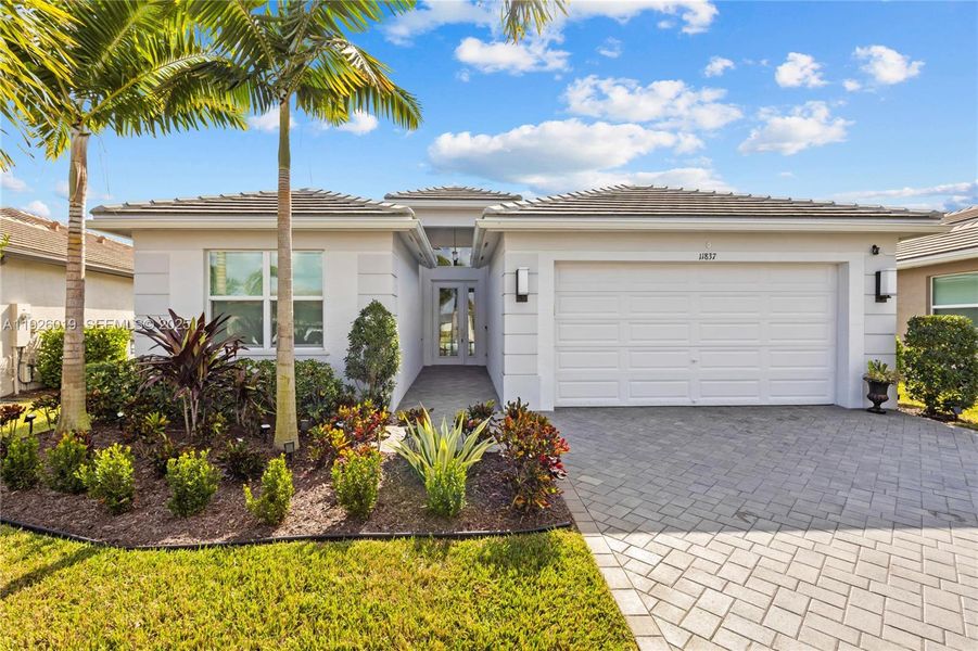 Front exterior of a new home in , Port St. Lucie, FL, highlighting curb appeal (Image 1). Front exterior of a new home in , Port St. Lucie, FL, highlighting curb appeal (Image 1).