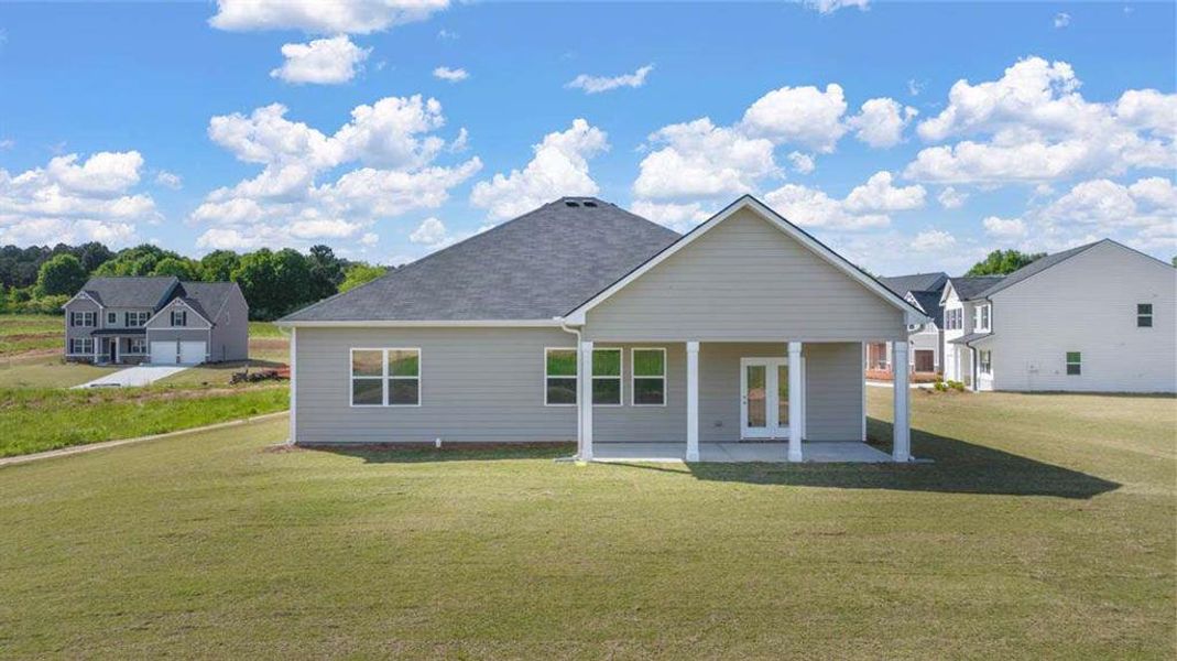 Exterior details and patio area of a home in Preserve at Dove Creek, Statham (Image 3).