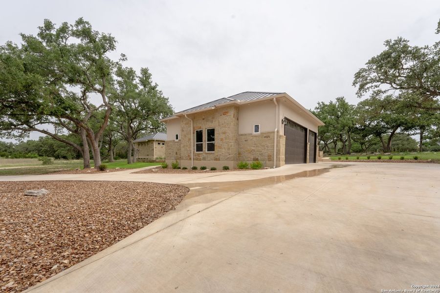 Front exterior of a new home in , Spring Branch, TX, highlighting curb appeal (Image 19).