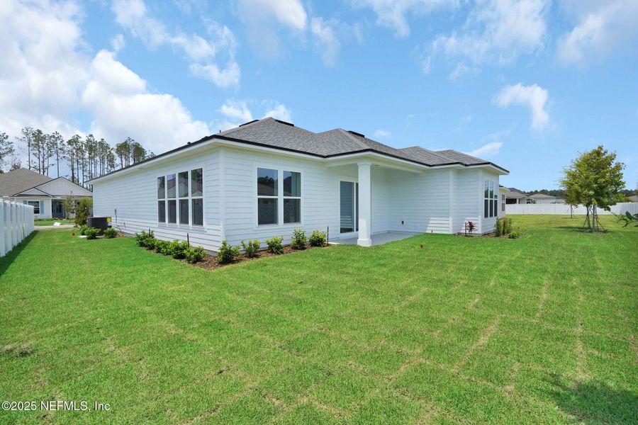 Exterior details and patio area of a home in Forest Park at Wildlight, Yulee (Image 2).