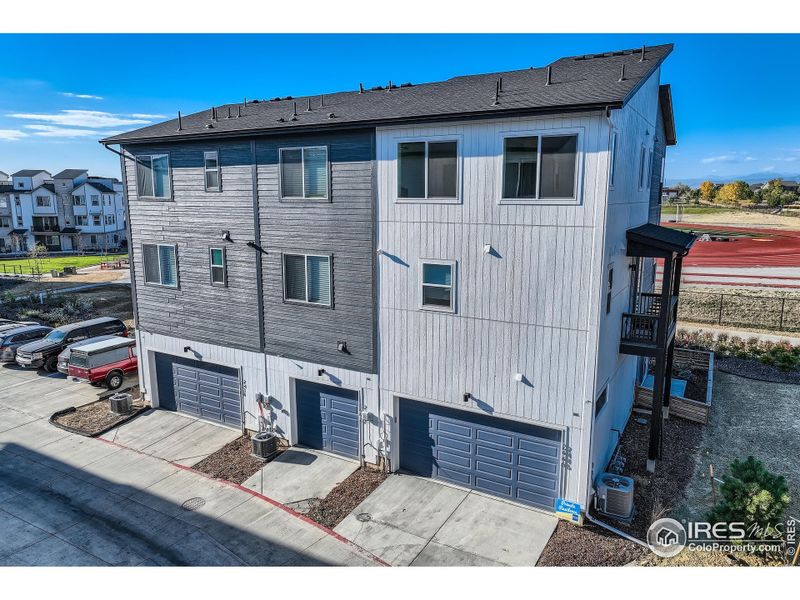 The back of 2446 W 167th Place includes a 2-car garage.