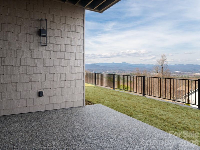 Exposed Aggregate Patio - Basement/Terrace level with fenced backyard and fantastic mountain views