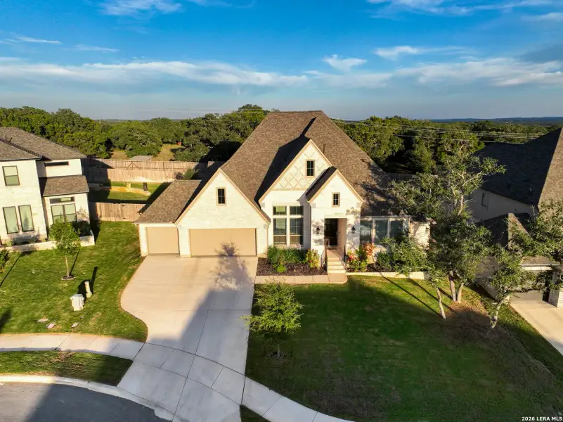 Front exterior of a new home in The Ranches at Creekside, Boerne, TX, highlighting curb appeal (Image 25). Front exterior of a new home in The Ranches at Creekside, Boerne, TX, highlighting curb appeal (Image 25).
