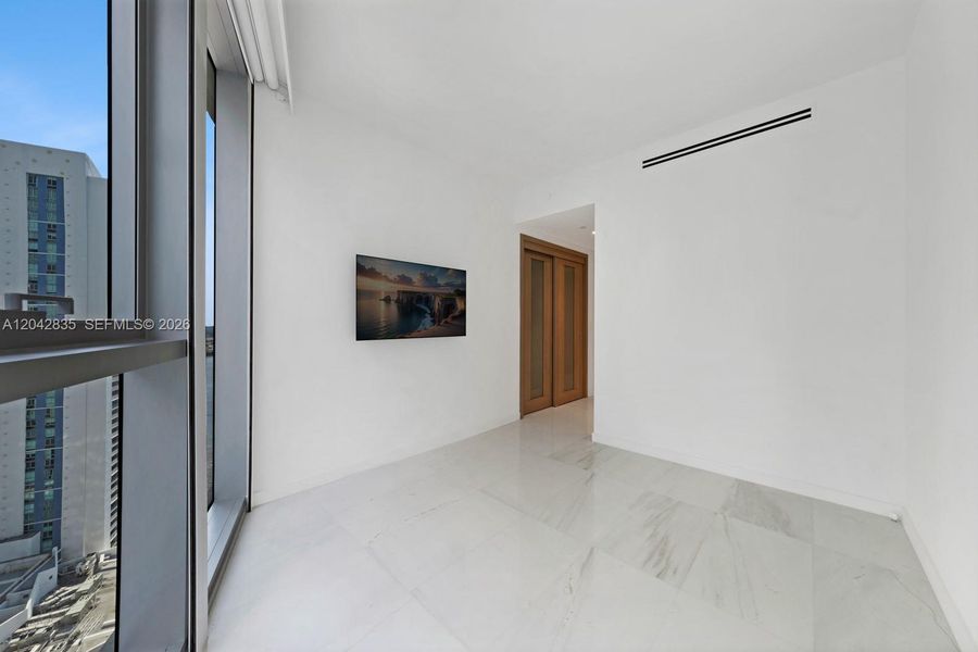 Spacious, unfurnished interior of a new home in Aston Martin Residences, Miami (Image 24).