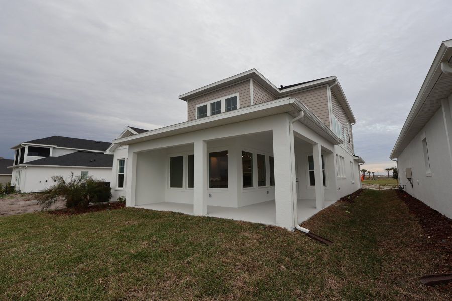 Exterior details and patio area of a home in Emerald Landing at Waterside at Lakewood Ranch – Lake Series, Sarasota (Image 3).