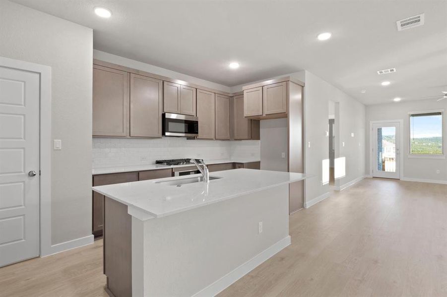 Kitchen in the Willow home plan by Trophy Signature Homes – REPRESENTATIVE PHOTO Kitchen in the Willow home plan by Trophy Signature Homes – REPRESENTATIVE PHOTO