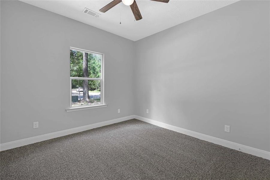 Bedroom #2 with front yard view.