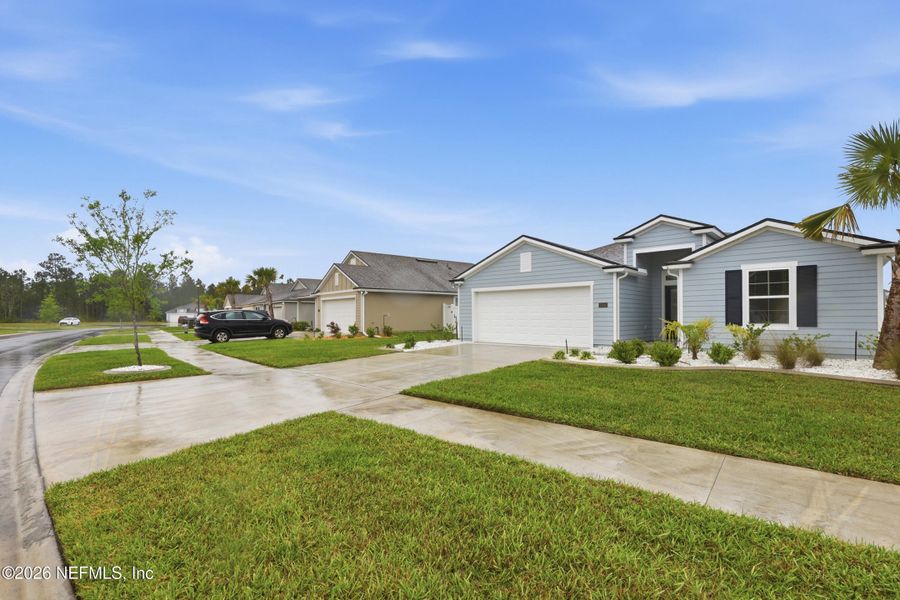 Front exterior of a new home in Cross Creek, Green Cove Springs, FL, highlighting curb appeal (Image 22).