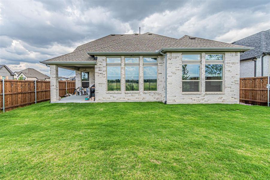 Exterior details and patio area of a home in , Aubrey (Image 28).