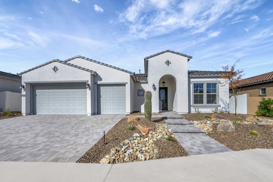 Front exterior of a new home in Canyon Views – 70’ Sunrise Series, Litchfield Park, AZ, highlighting curb appeal (Image 1). Front exterior of a new home in Canyon Views – 70’ Sunrise Series, Litchfield Park, AZ, highlighting curb appeal (Image 1).